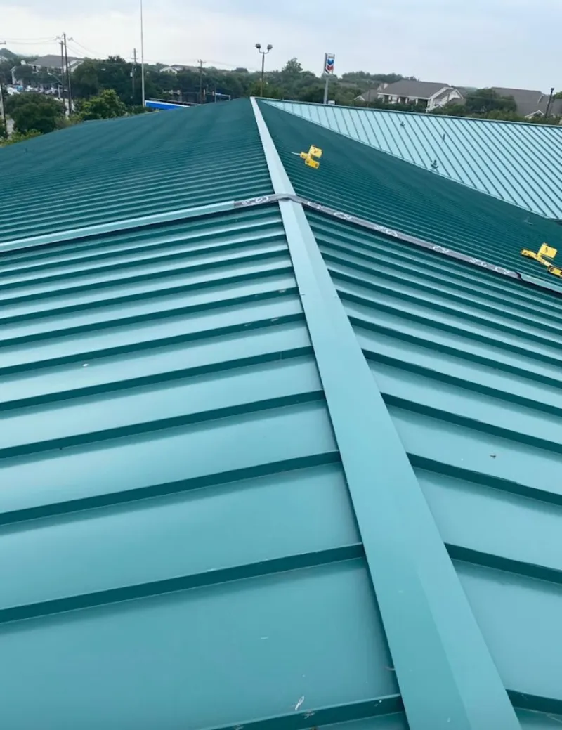Green commercial metal roof ridge and valley for Metal Roof Repair in Spring